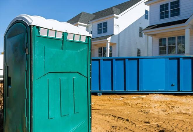 row of portable toilets providing essential facilities at a construction site